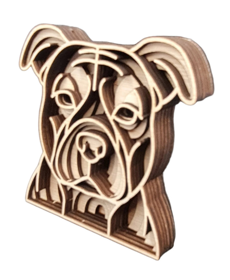 A wooden Staffordshire Bull Terrierdog head featuring a unique pattern of lines, showcasing craftsmanship and artistic design.